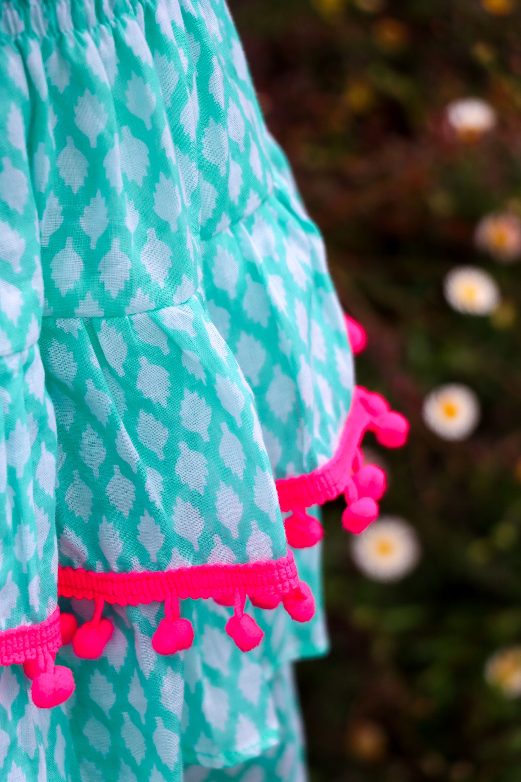 Rara Skort - green fir cone with pink pompoms