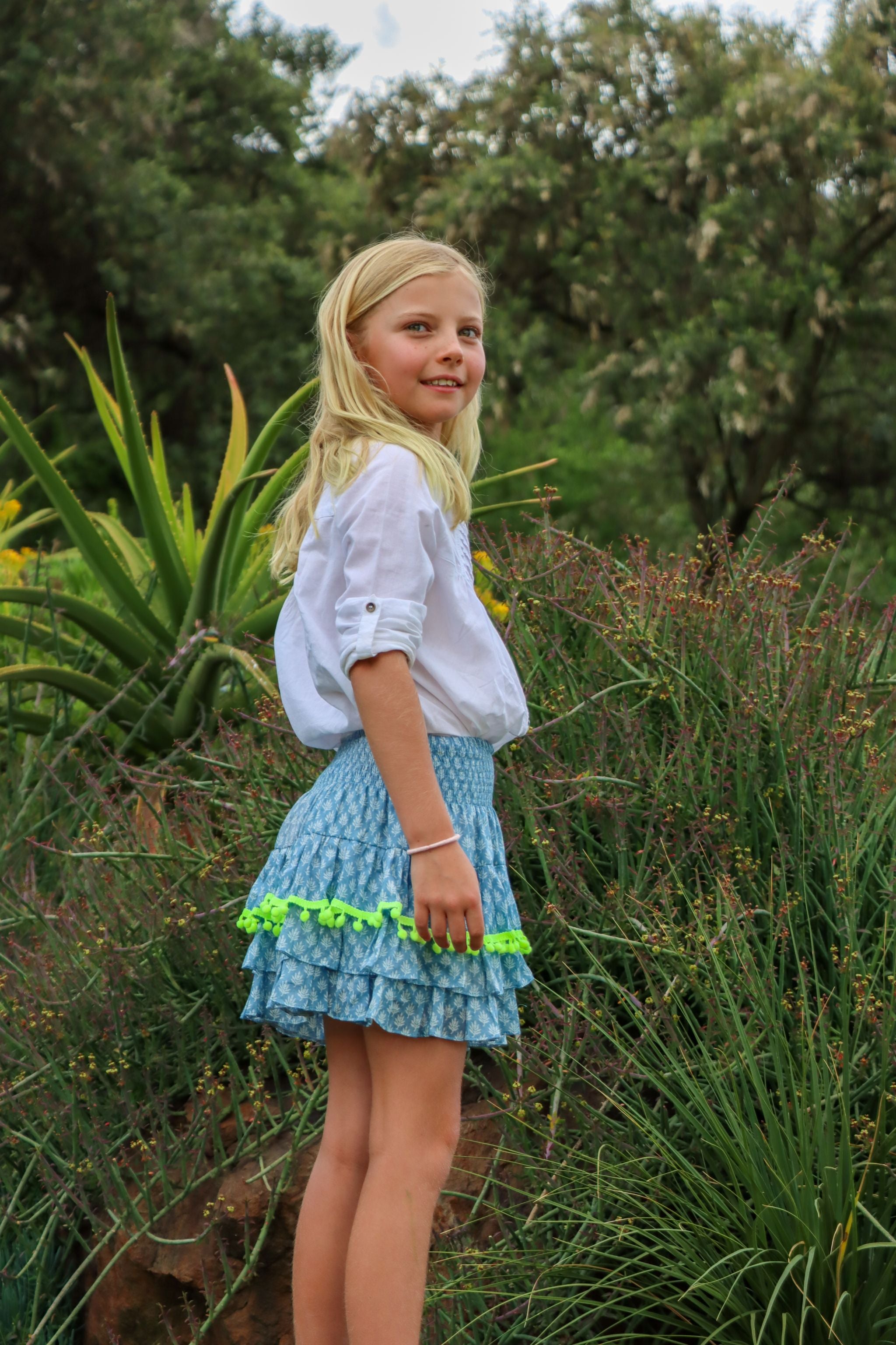 Rara Skort - blue fern with neon yellow pompoms