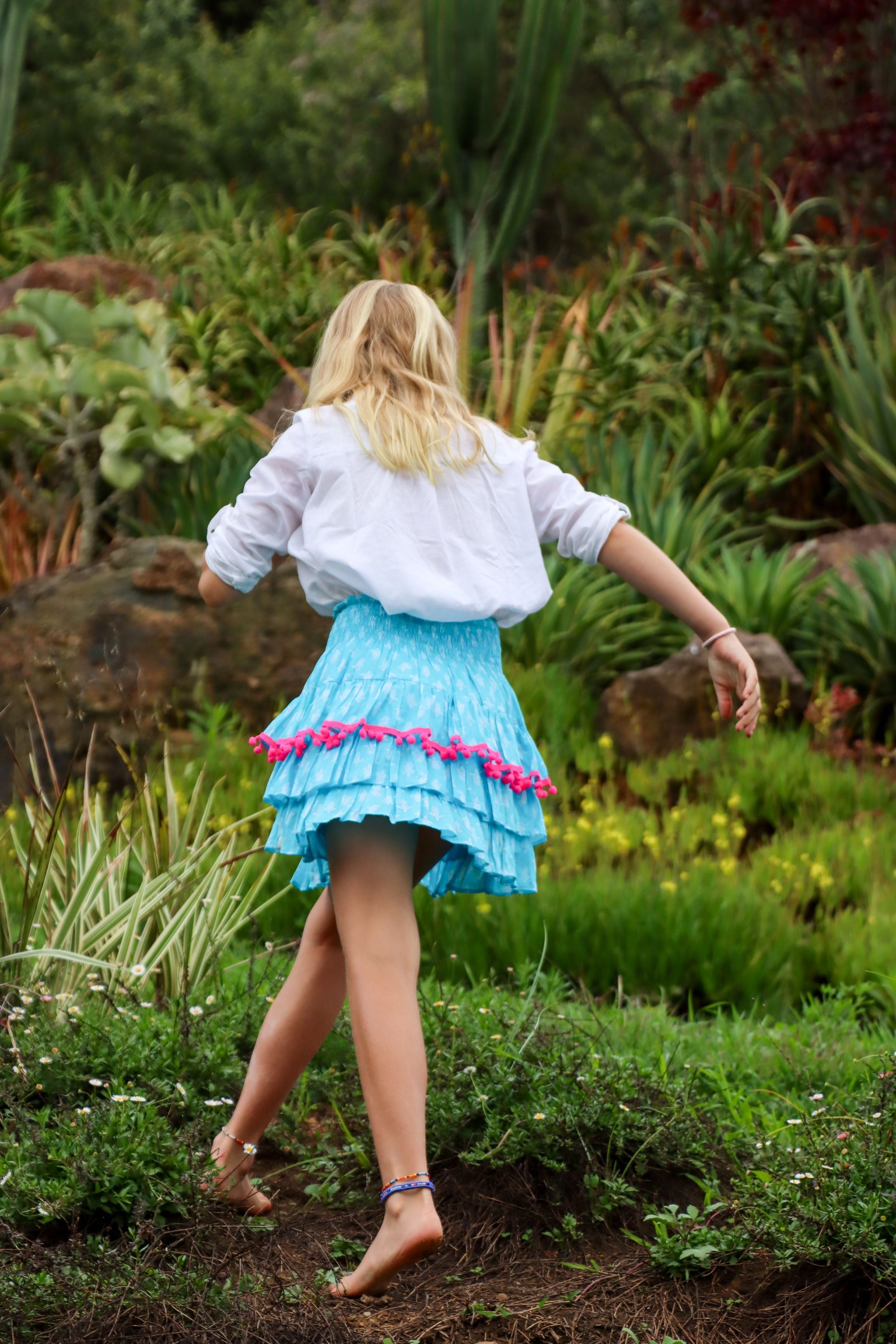 Rara Skort - aqua blue with pink pompoms