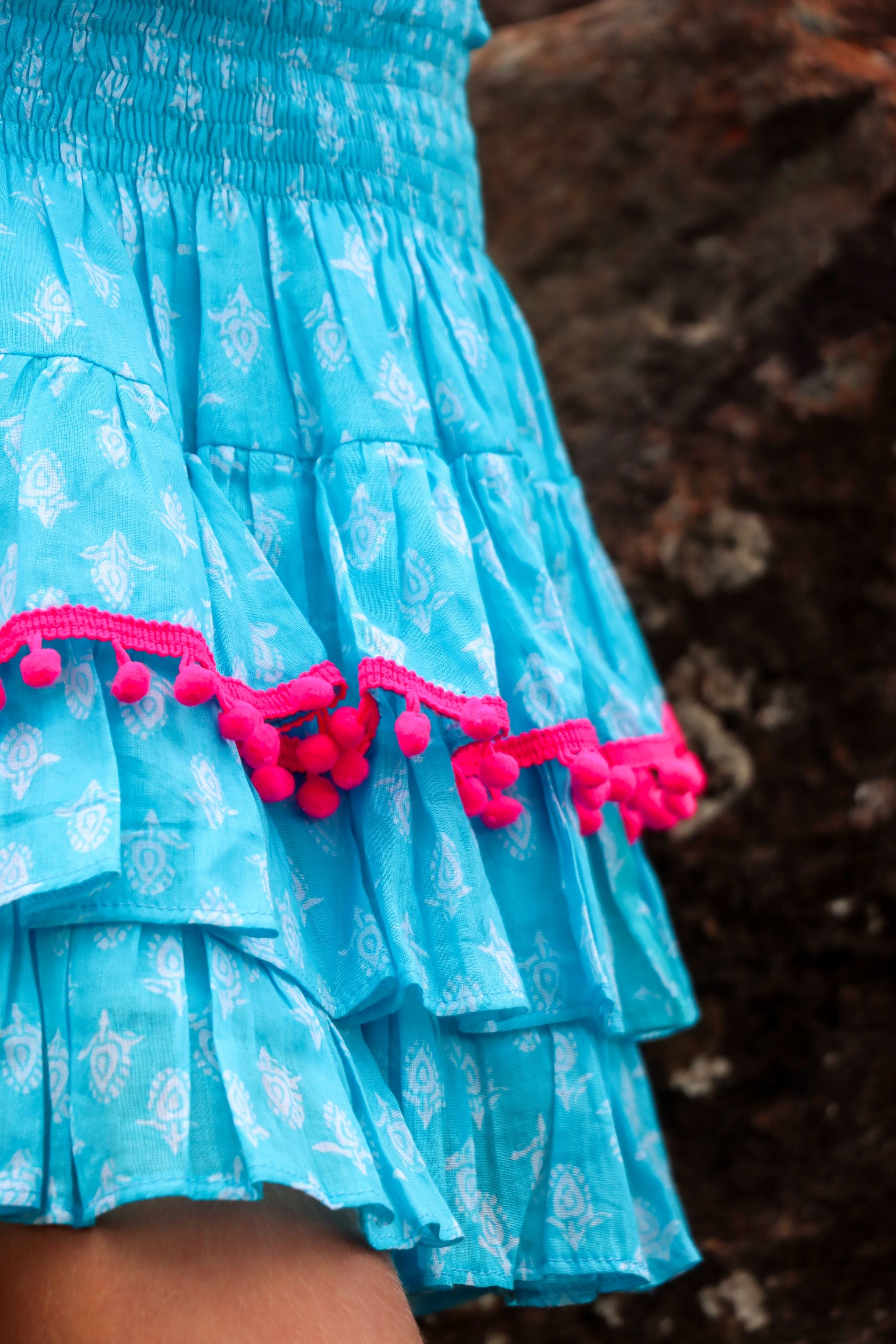 Rara Skort - aqua blue with pink pompoms