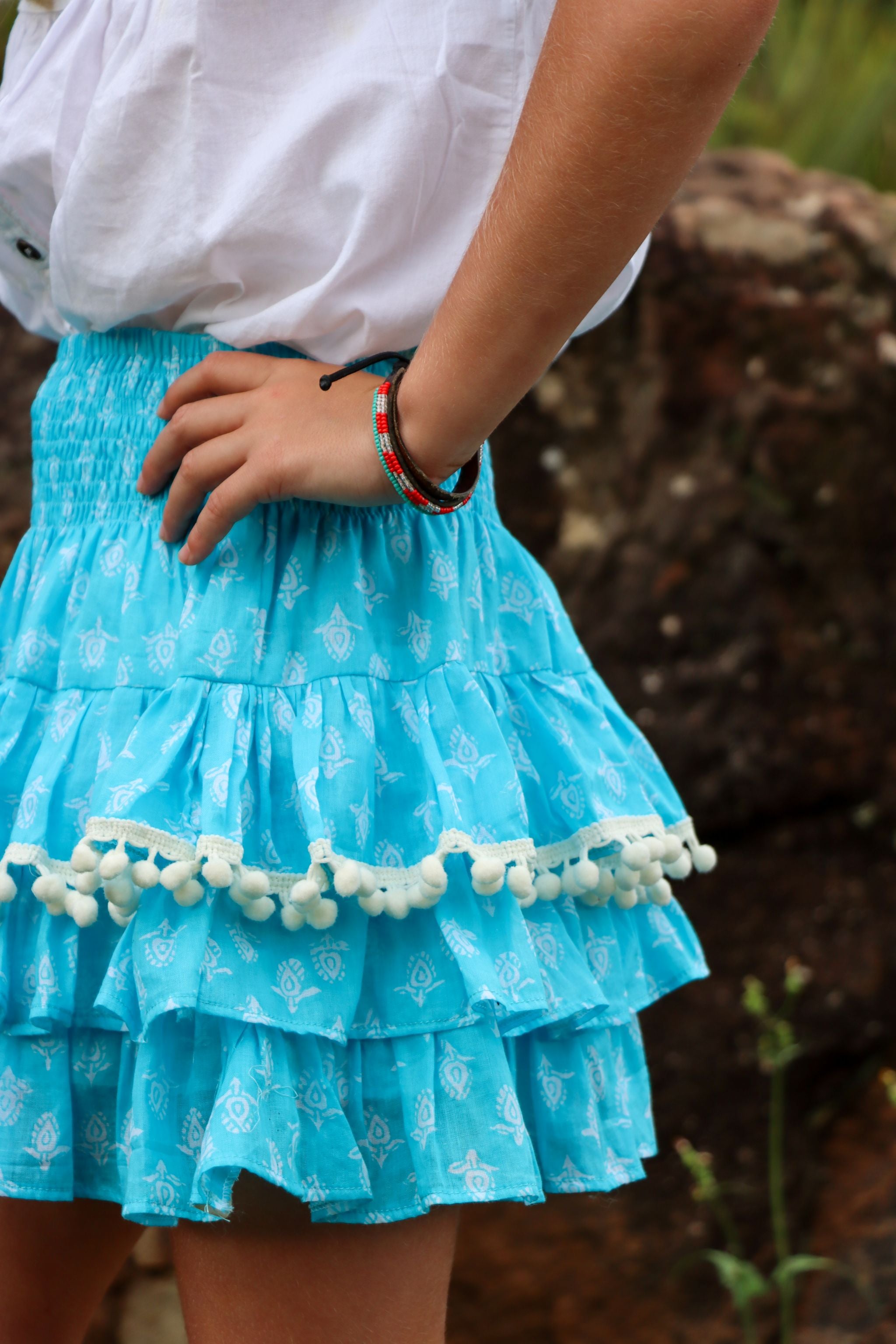Rara Skort - aqua blue with white pompoms