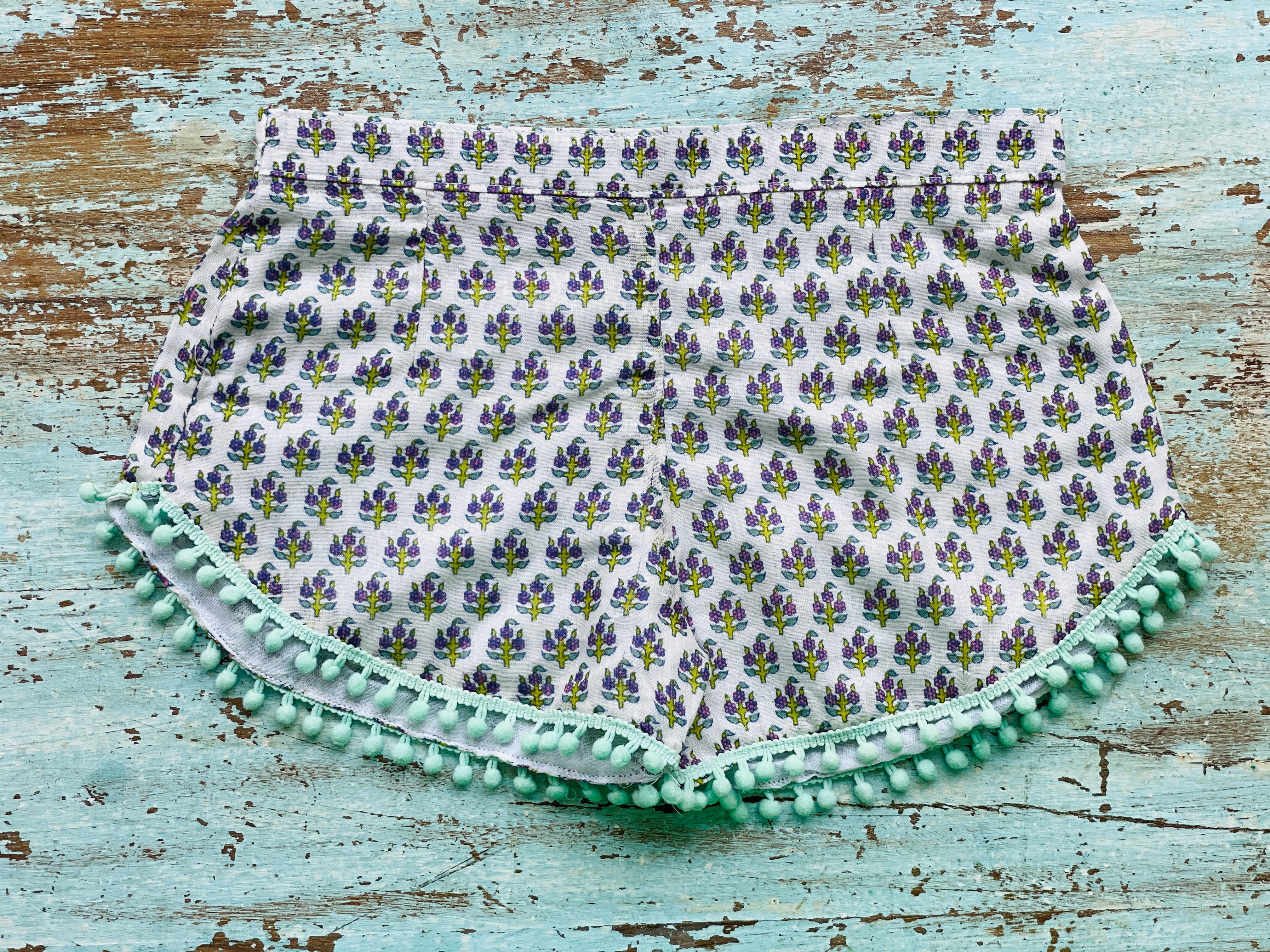 COASTIE SHORTS - Purple Green Flower Teal Bobble