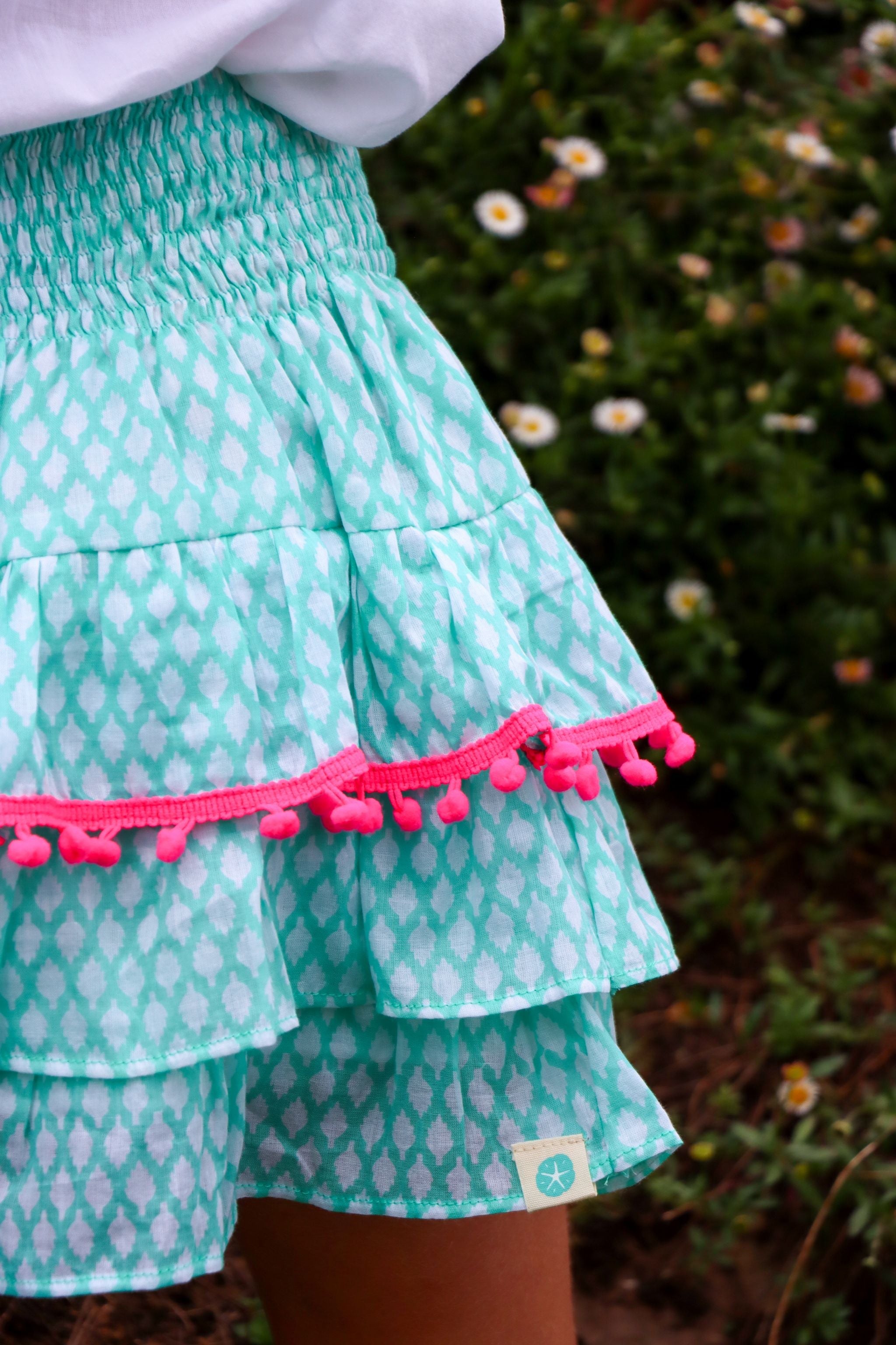 Rara Skort -  green fir cone with pink pompoms