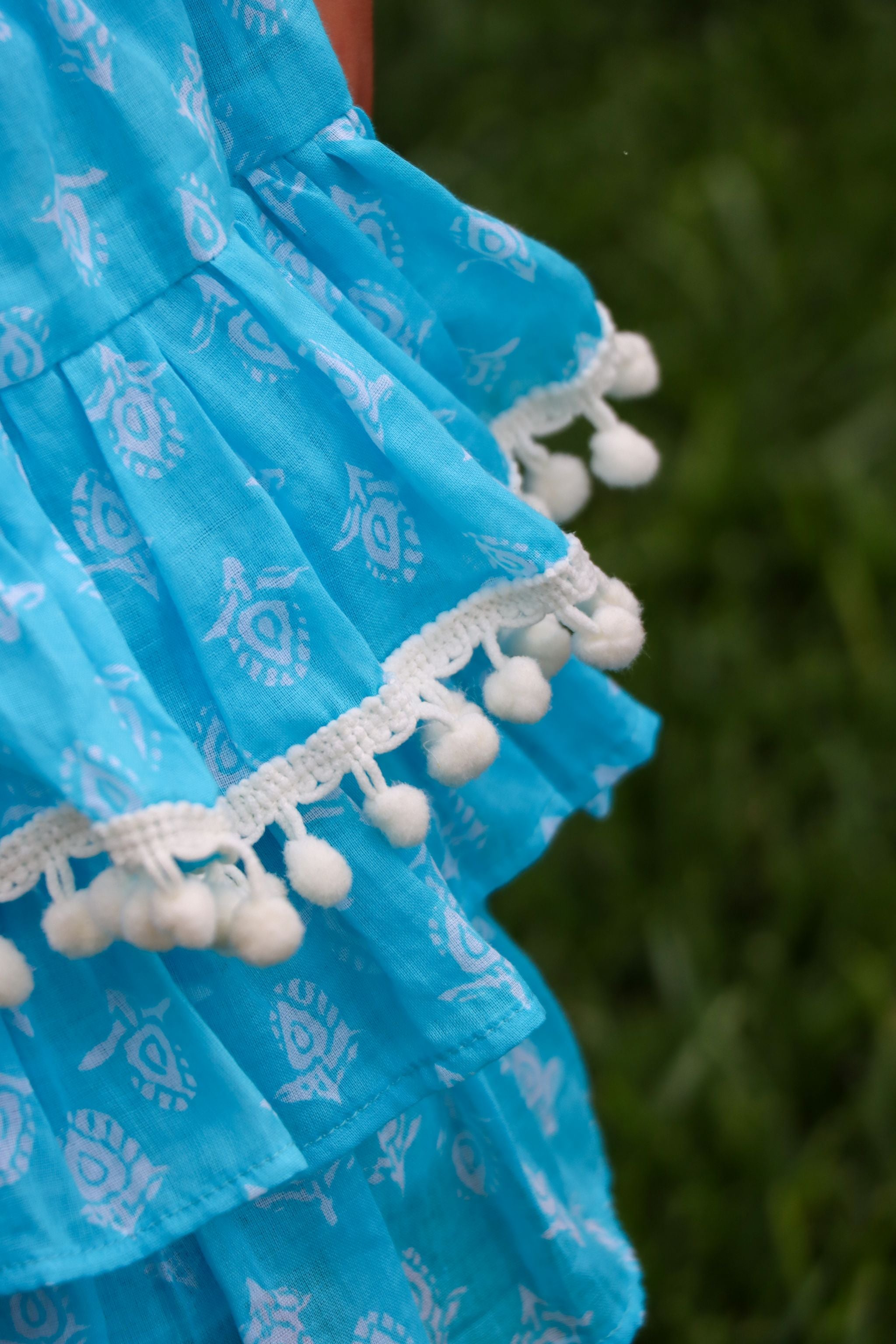 Rara Skort - aqua blue with white pompoms