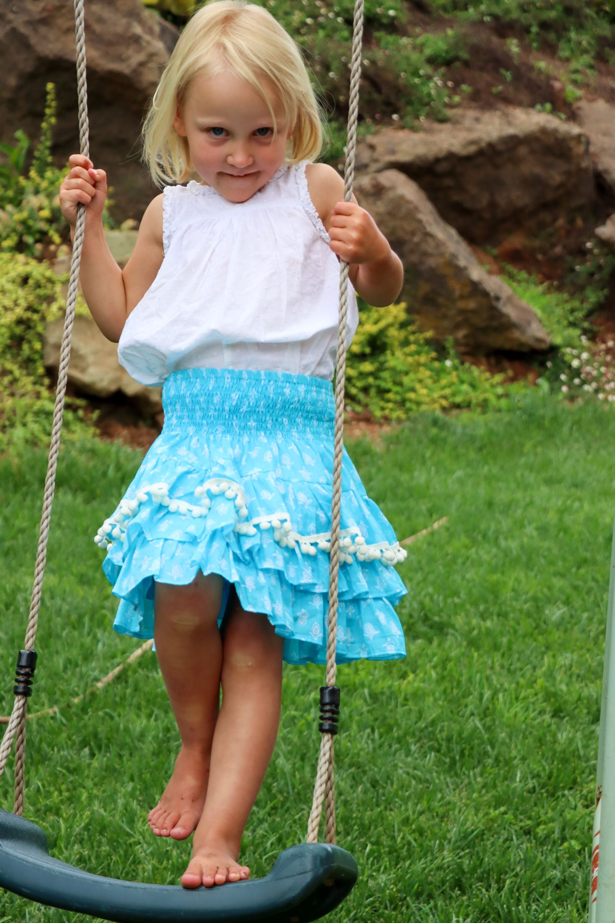 Rara Skort - aqua blue with white pompoms