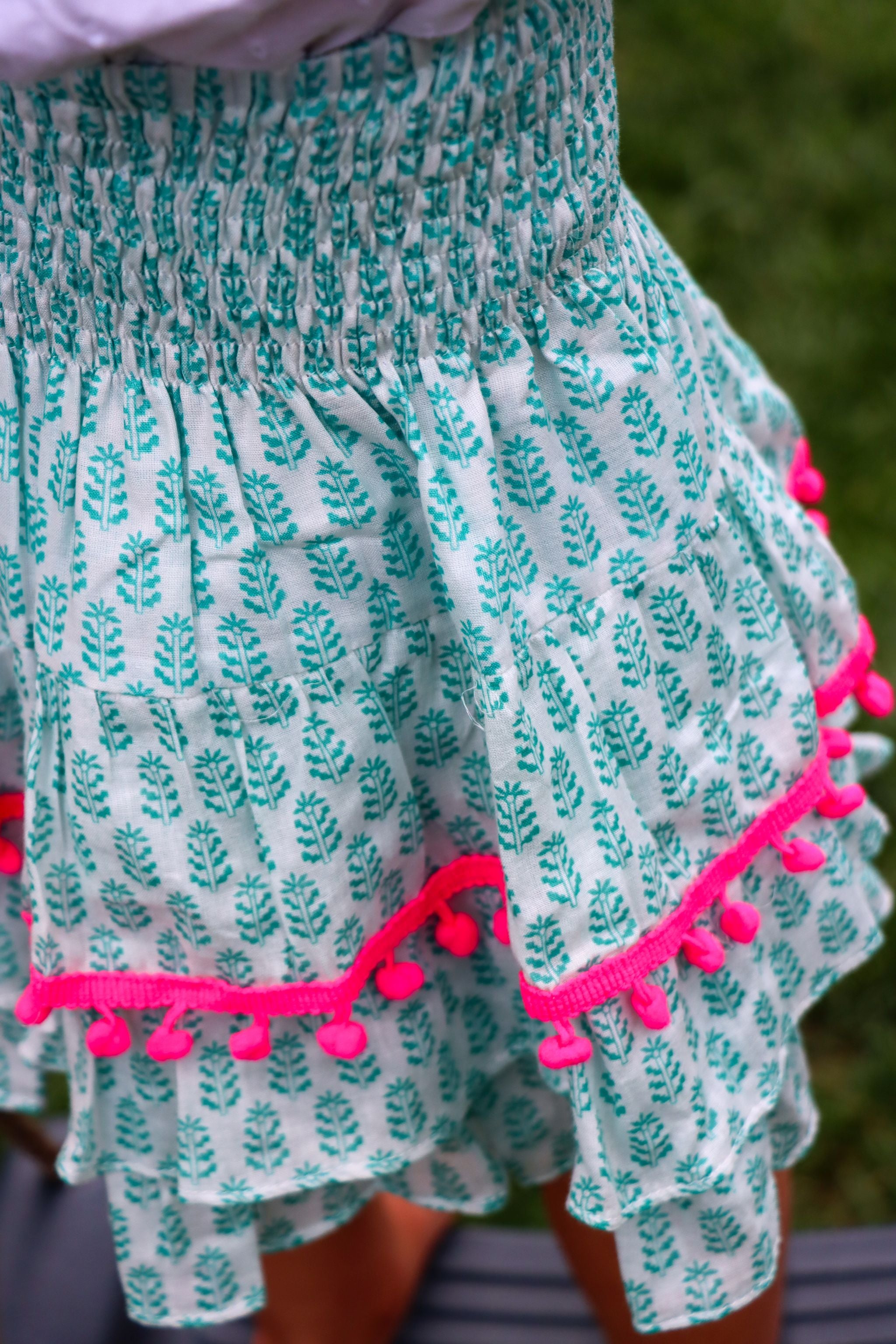 Rara Skort - green fern with neon pink pompoms
