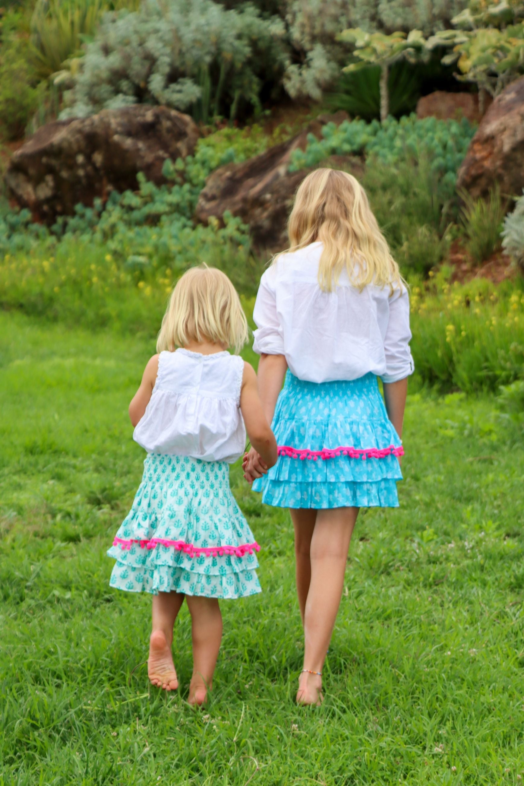 Rara Skort - aqua blue with pink pompoms