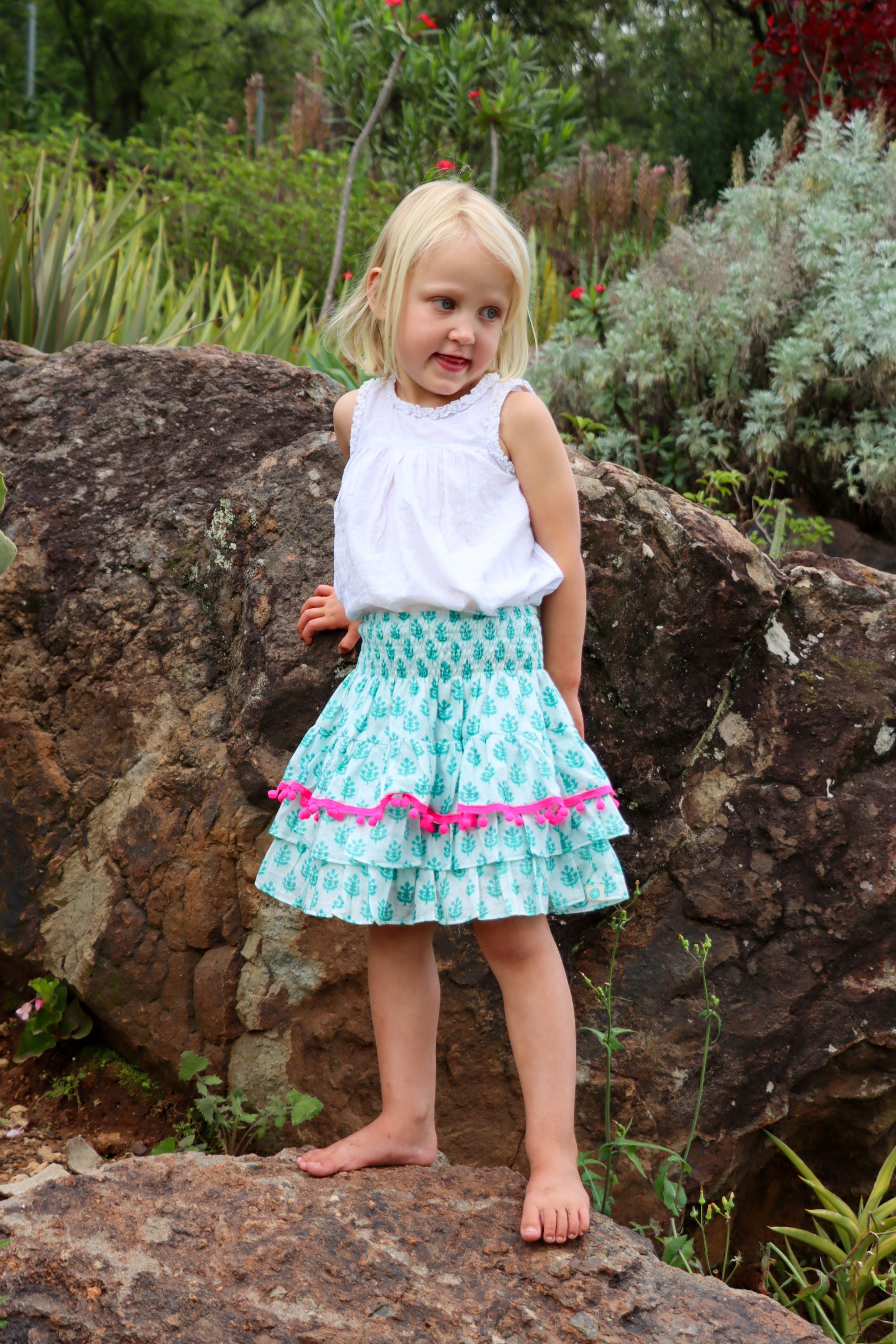 Rara Skort - sea holly with pink pompoms
