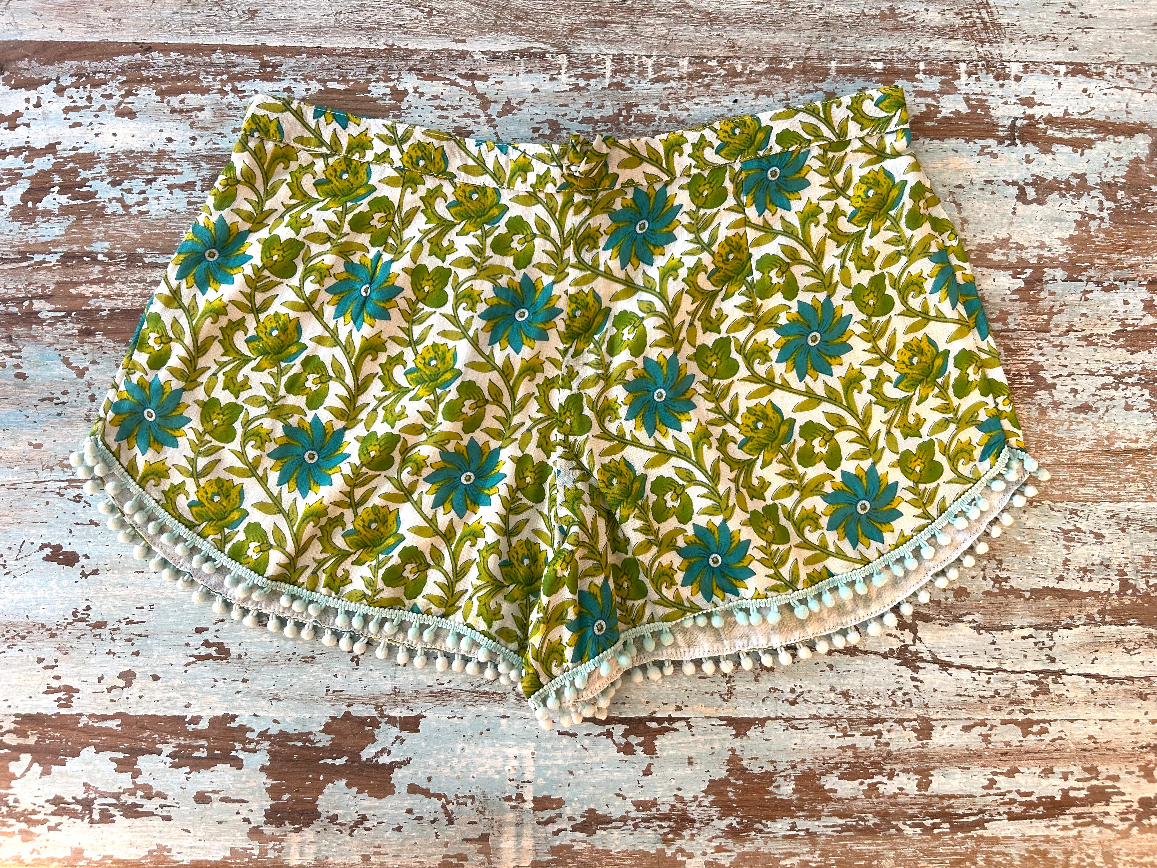 Coastie Shorts - green creepers with white pompoms (XS)